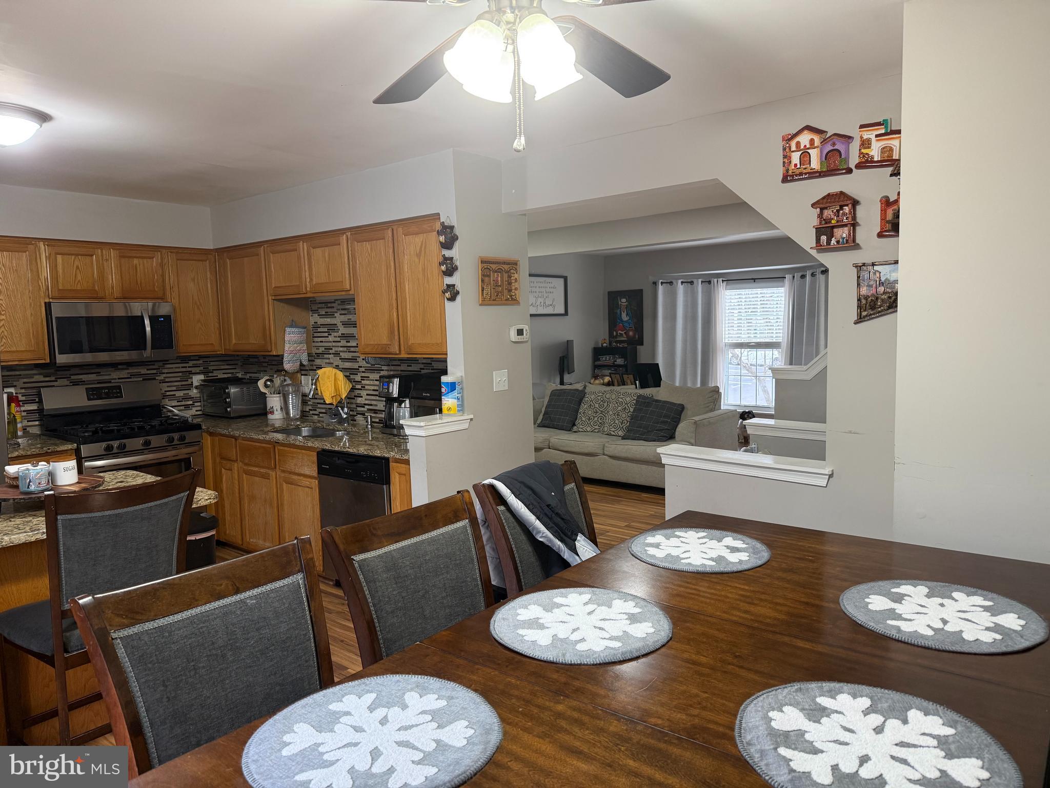 8575 Cold Harbor Loop Manassas, VA 20111 - Photo 7 of 17 a living room with furniture and a dining table