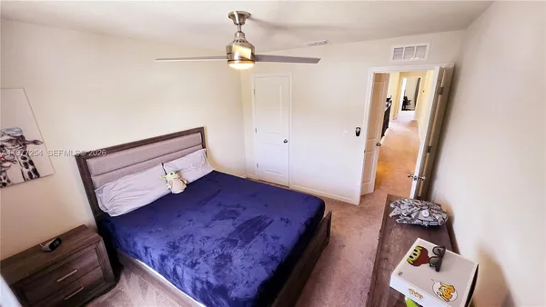 a view of living room with furniture and rug