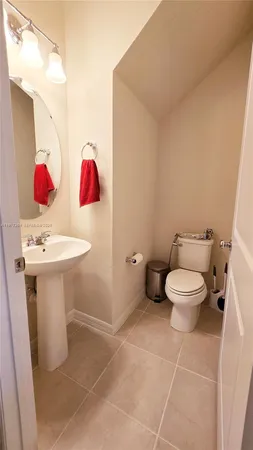a bathroom with a sink toilet and vanity