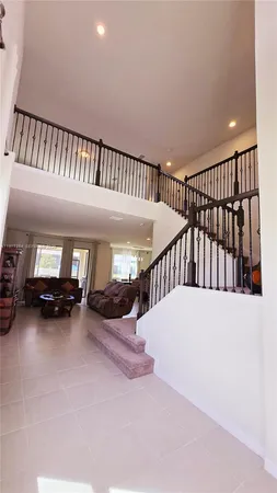 a view of livingroom with furniture and staircase