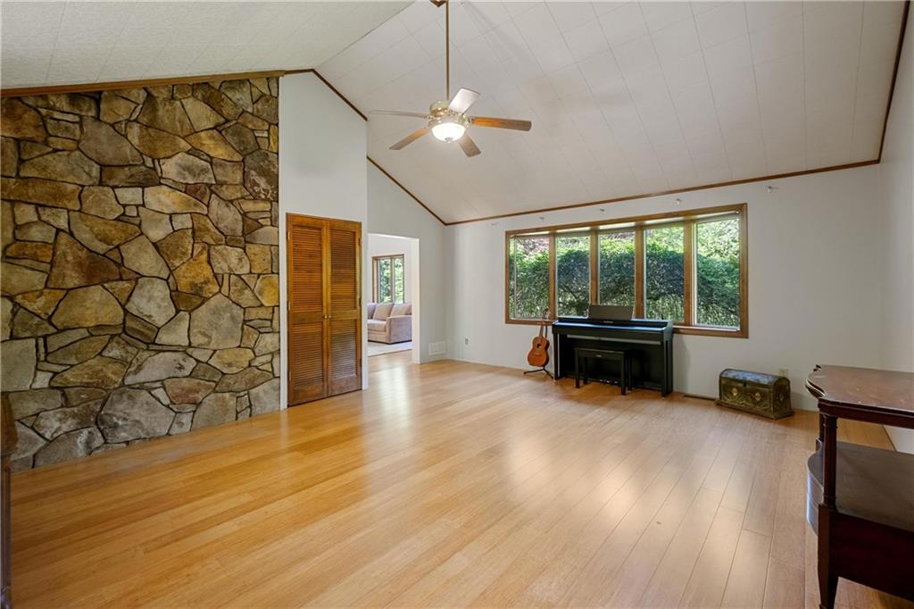 150 Dodds Road Butler, PA 16002 - Photo 11 of 37 a living room with fireplace furniture and a floor to ceiling window