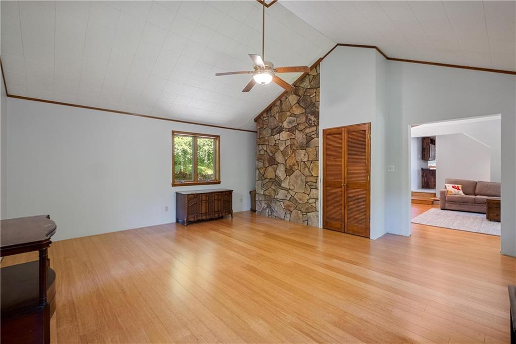 150 Dodds Road Butler, PA 16002 - Photo 12 of 37 a view of a livingroom with wooden floor and kitchen space