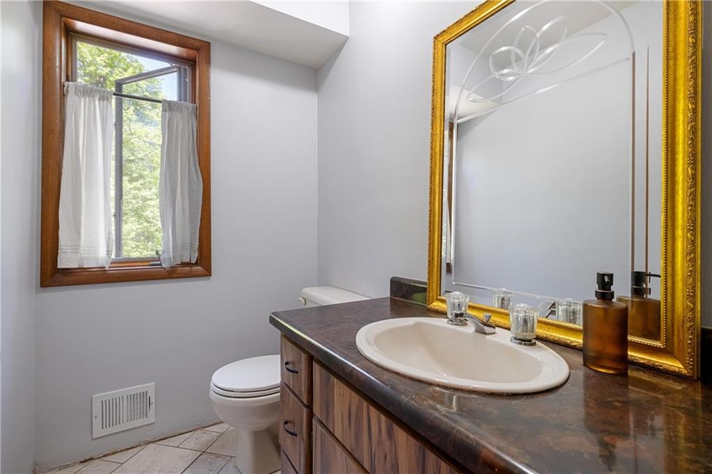 150 Dodds Road Butler, PA 16002 - Photo 25 of 37 a bathroom with a sink a toilet and mirror