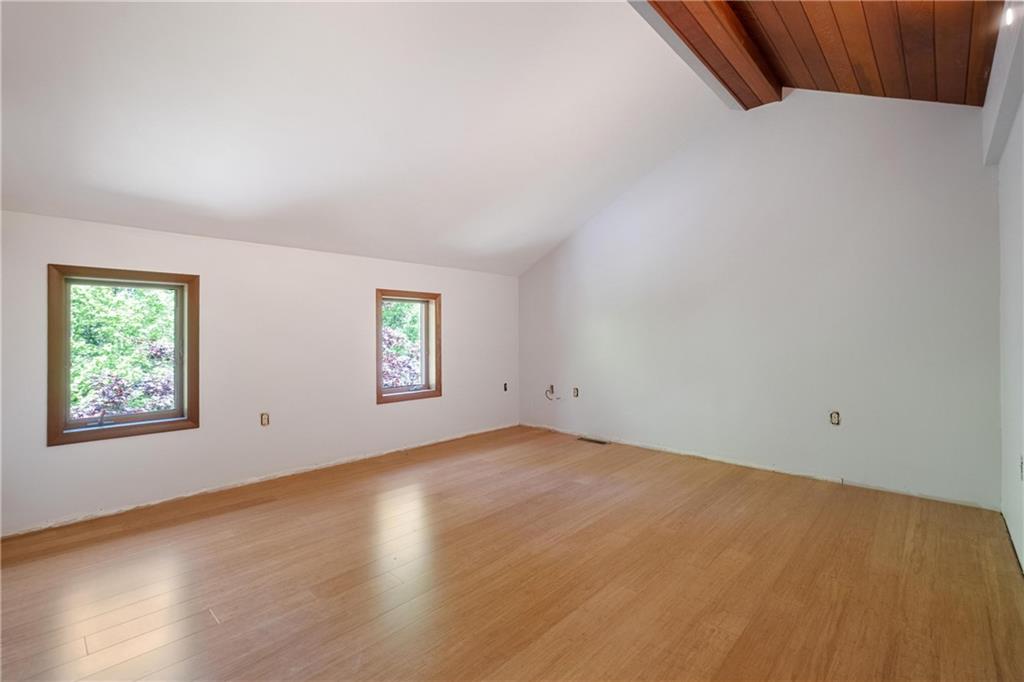 150 Dodds Road Butler, PA 16002 - Photo 33 of 37 an empty room with wooden floor and windows