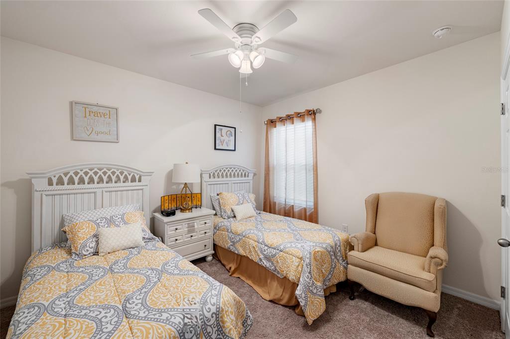 8921 Excelsior Loop Venice, FL 34293 - Photo 15 of 26 a bedroom with a bed and a couch