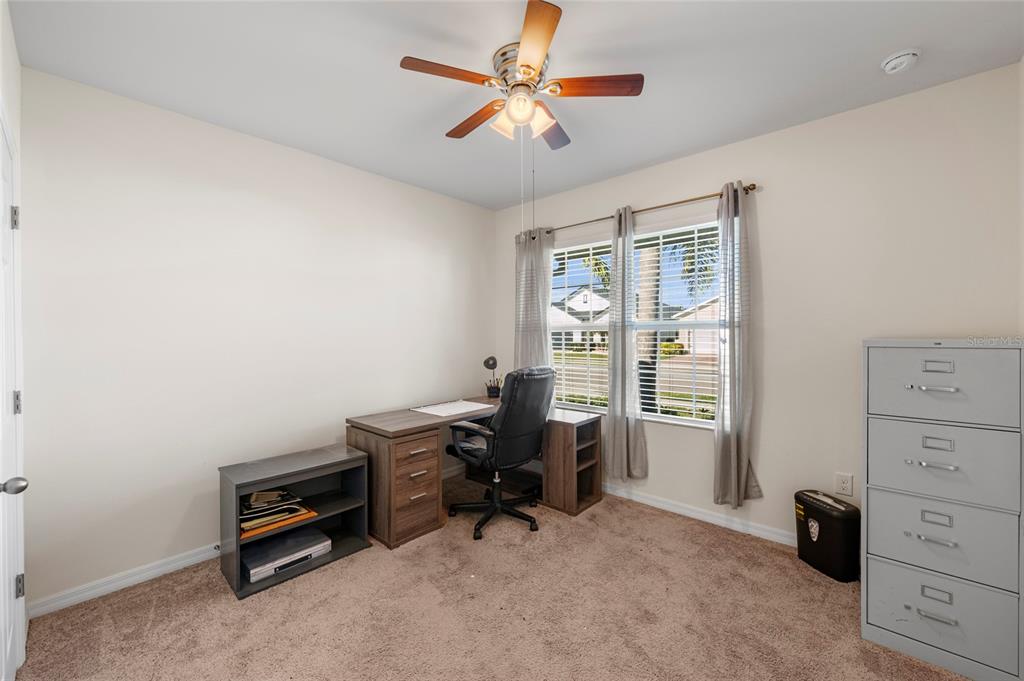 8921 Excelsior Loop Venice, FL 34293 - Photo 17 of 26 a view of a workspace with furniture and a window