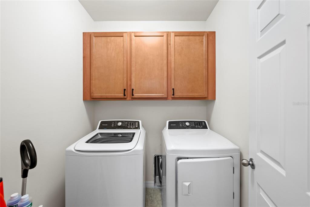 8921 Excelsior Loop Venice, FL 34293 - Photo 19 of 26 a view of storage and utility room with washer and dryer