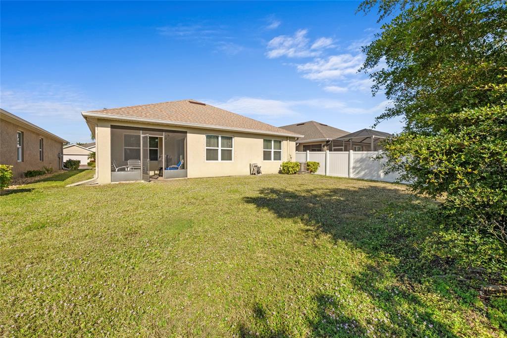8921 Excelsior Loop Venice, FL 34293 - Photo 22 of 26 a view of a house with a big yard