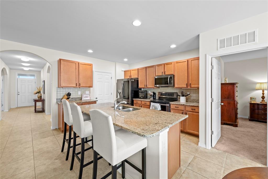 8921 Excelsior Loop Venice, FL 34293 - Photo 6 of 26 a view of a dining room kitchen and stainless steel appliances