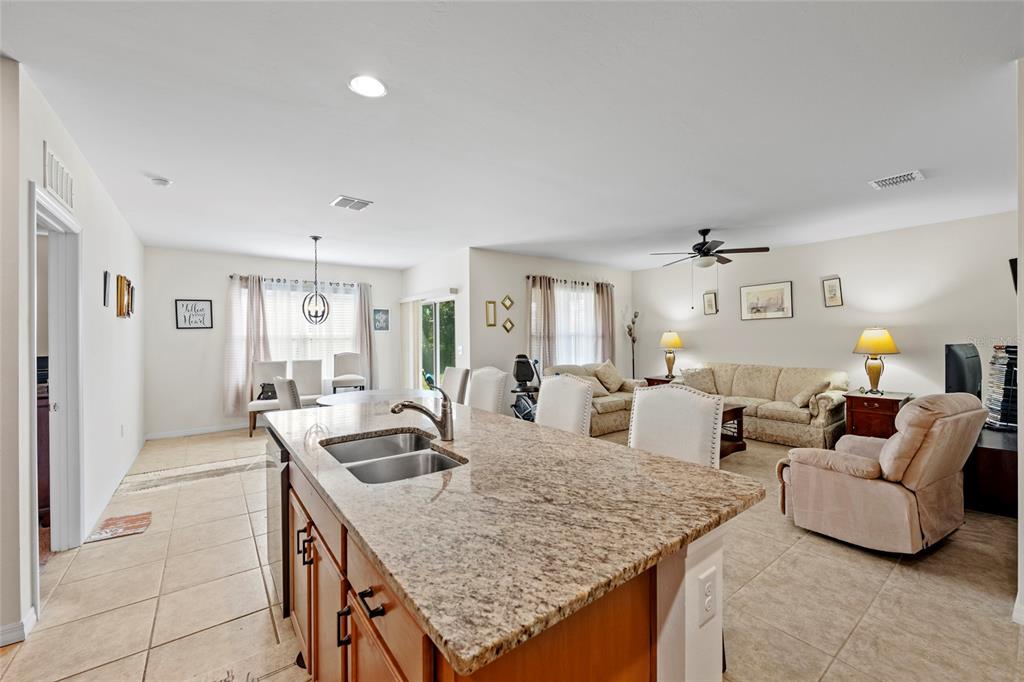 8921 Excelsior Loop Venice, FL 34293 - Photo 7 of 26 a living room with furniture and wooden floor