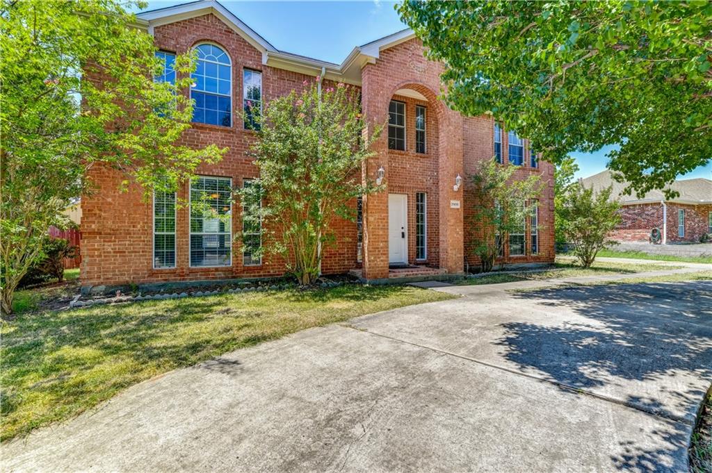 2906 Toler Road Rowlett, TX 75089 - Photo 1 of 1 a front view of a house with a yard and garage