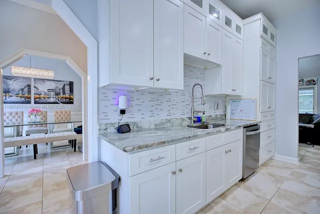 a bathroom with a sink mirror and toilet