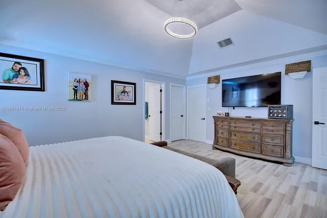 a view of a bathroom with a shower and a sink