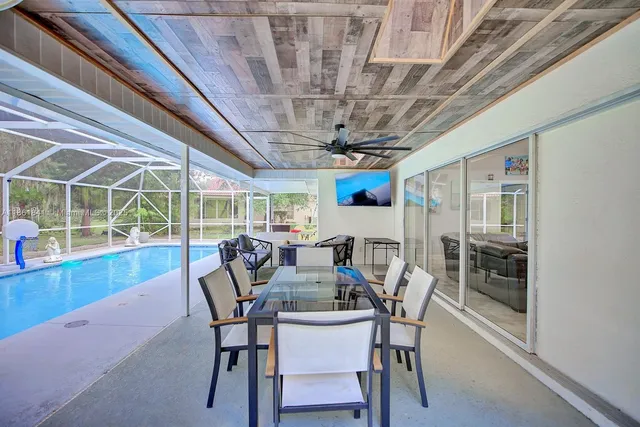 a view of a swimming pool with a lounge chair