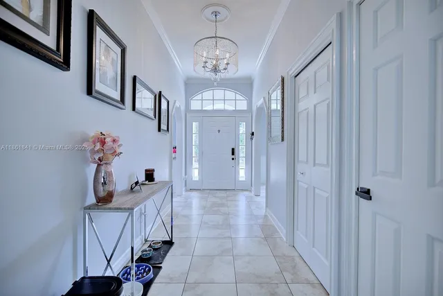 a view of hall way with furniture