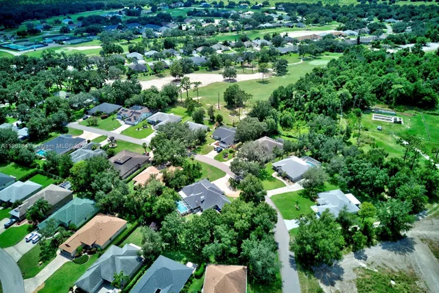 an aerial view of residential house with outdoor space and street view