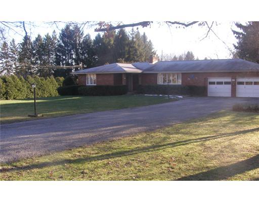 Exterior Front. This sprawling custom ranch sits on a beautiful 1 acre lot on a private cul de sac. note the turn around driveway. Inside the oversized ,dry-walled garage, there is a walk out to the rear lawn equipment shelter.
