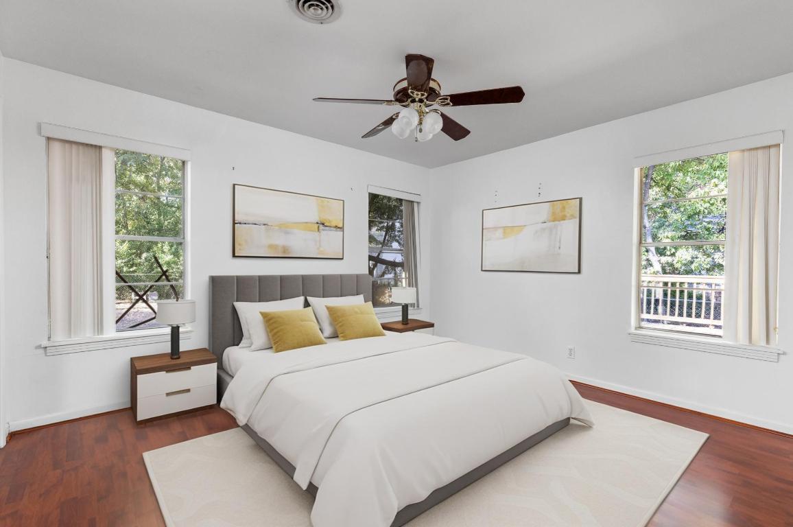 1105 Alegria Road Austin, TX 78757 - Photo 20 of 30 a bedroom with a large bed and a window
