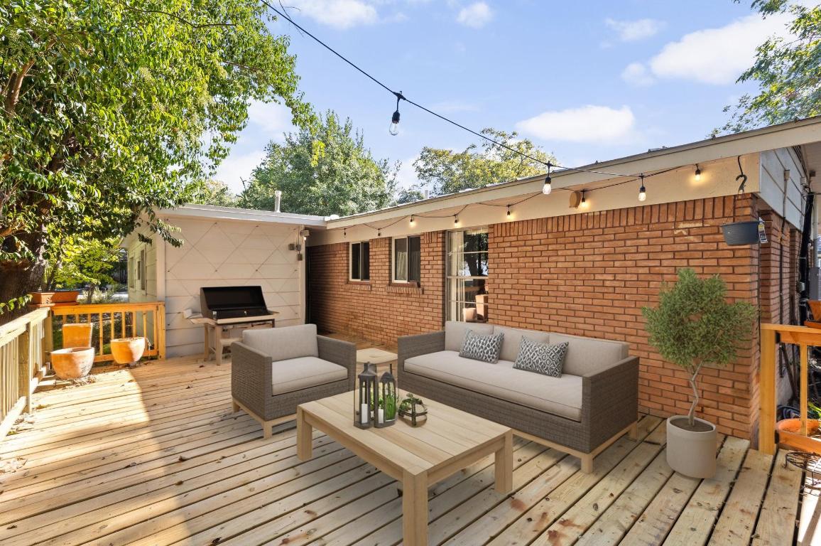 1105 Alegria Road Austin, TX 78757 - Photo 24 of 30 a view of a patio with couches and table with wooden floor