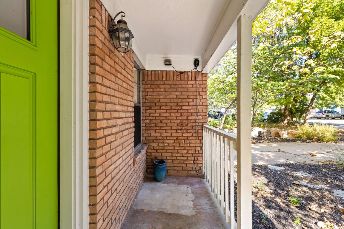 1105 Alegria Road Austin, TX 78757 - Photo 3 of 30 a view of a door and wooden floor and outdoor space