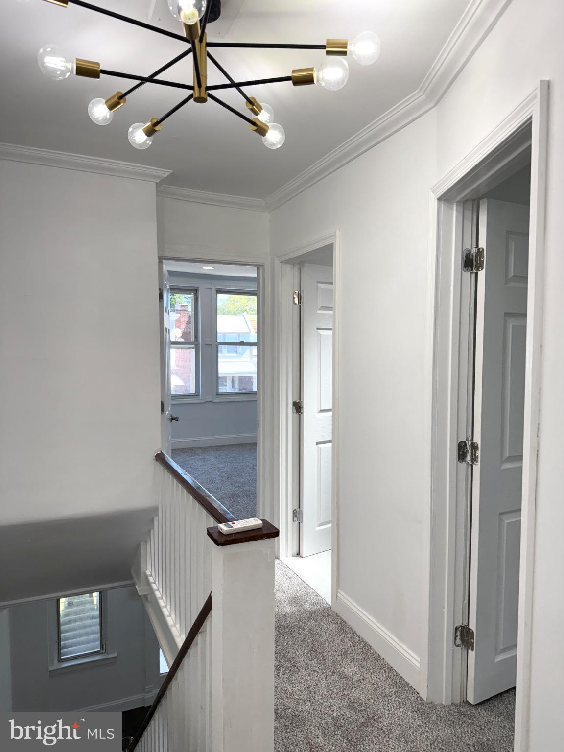6824 Rodney Street Philadelphia, PA 19138 - Photo 11 of 28 a bathroom with a granite countertop sink a mirror and shower