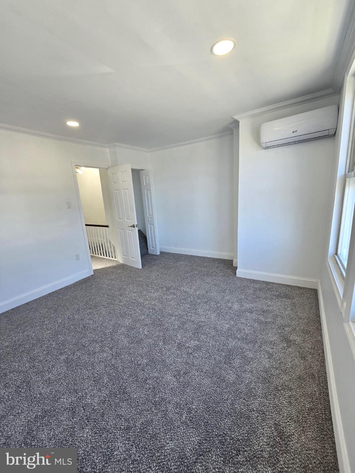 6824 Rodney Street Philadelphia, PA 19138 - Photo 12 of 28 an empty room with a window and stairs