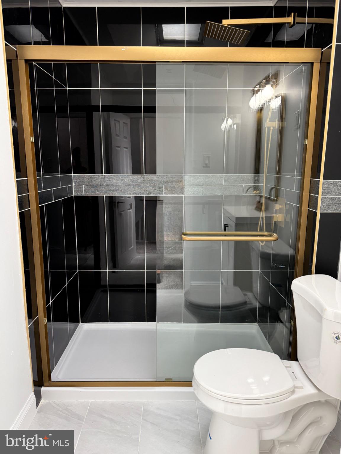 6824 Rodney Street Philadelphia, PA 19138 - Photo 18 of 28 a bathroom with a toilet and a shower