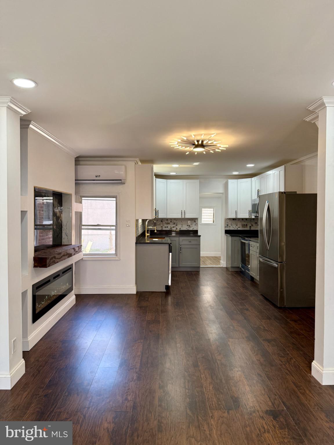 6824 Rodney Street Philadelphia, PA 19138 - Photo 5 of 28 a view of kitchen with stainless steel appliances wooden floor and large window