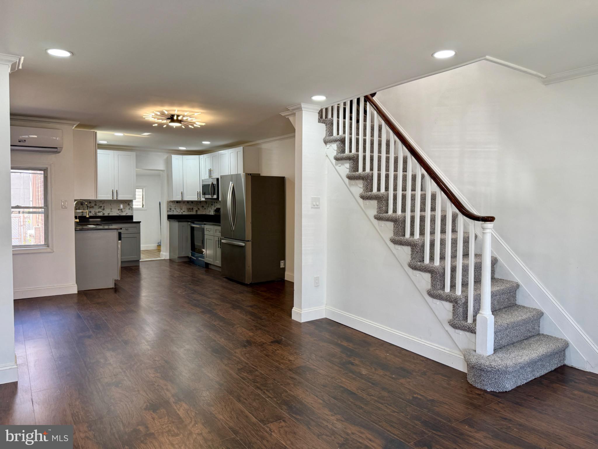 6824 Rodney Street Philadelphia, PA 19138 - Photo 8 of 28 a view of entryway and kitchen with wooden floor