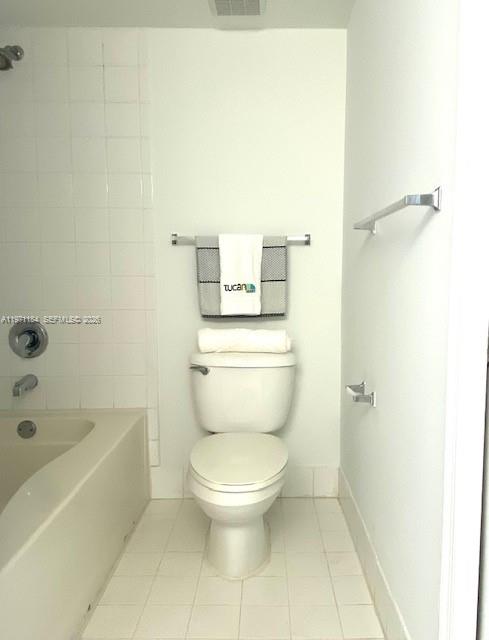 2061 Renaissance Boulevard, Unit 204 Miramar, FL 33025 - Photo 13 of 27 a white toilet sitting next to a bath tub