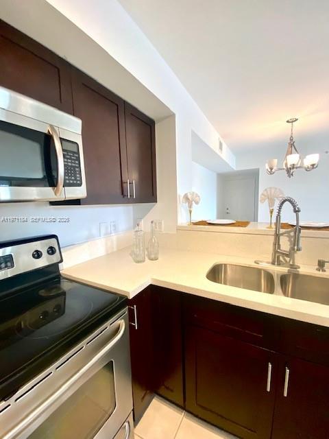 2061 Renaissance Boulevard, Unit 204 Miramar, FL 33025 - Photo 16 of 27 a kitchen with a sink and stainless steel appliances