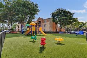 2061 Renaissance Boulevard, Unit 204 Miramar, FL 33025 - Photo 26 of 27 a view of a park with slide