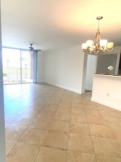 2061 Renaissance Boulevard, Unit 204 Miramar, FL 33025 - Photo 4 of 27 a view of a room with a chandelier