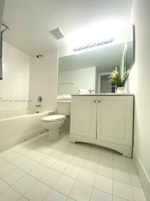2061 Renaissance Boulevard, Unit 204 Miramar, FL 33025 - Photo 6 of 27 a bathroom with a sink a toilet and mirror