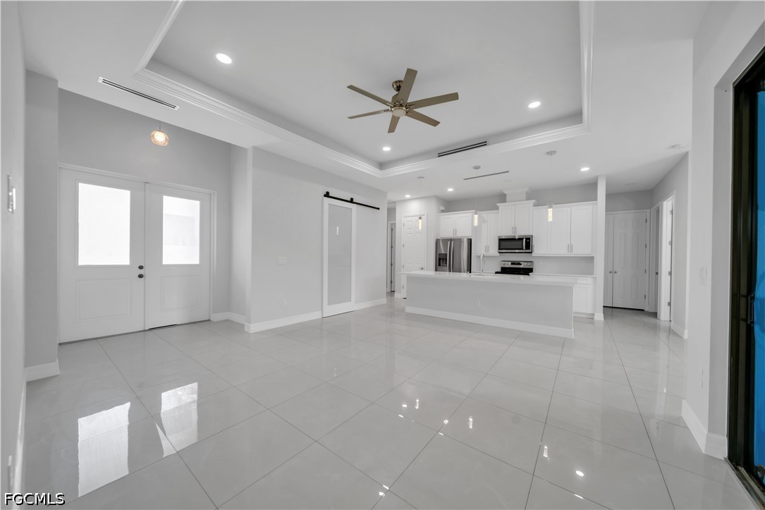 3509 38th Street Southwest Lehigh Acres, FL 33976 - Photo 16 of 47 a view of a livingroom with a ceiling fan