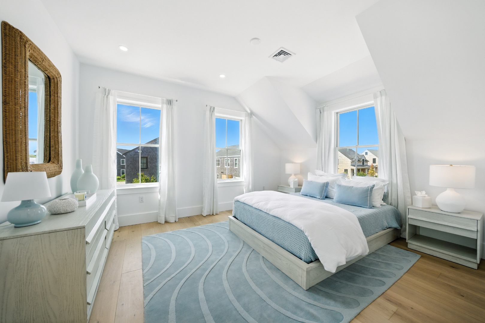 10 Beach Grass Road Nantucket, MA 02554 - Photo 18 of 29 a bedroom with a large bed and windows