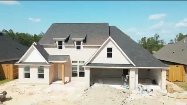 a aerial view of a house with a yard