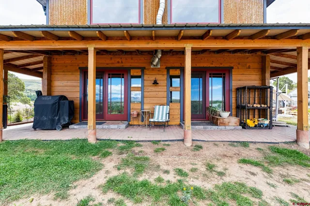 a view of a backyard with seating area and furniture