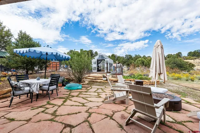 a view of a patio with swimming pool table and chairs