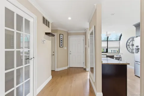 a view of a hallway with a living room