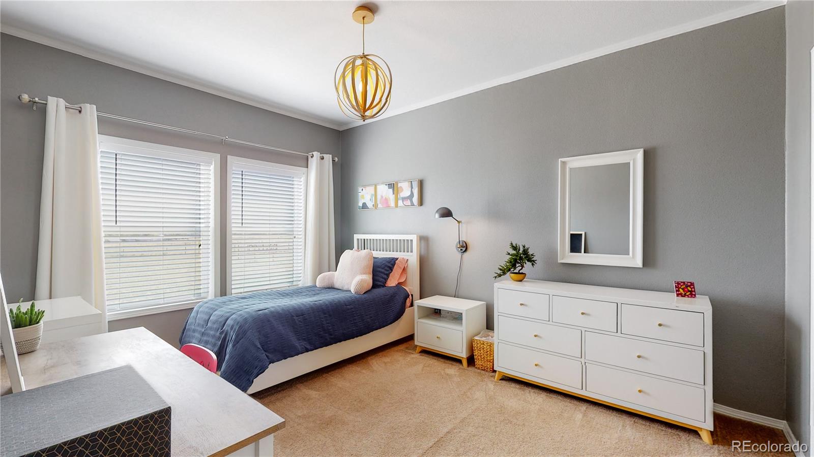 4038 Meadowlark Road Fort Lupton, CO 80621 - Photo 19 of 40 a bedroom with a bed and a window