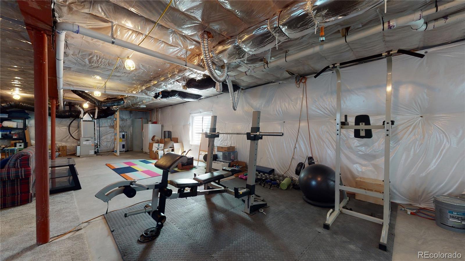 4038 Meadowlark Road Fort Lupton, CO 80621 - Photo 32 of 40 a view of a room with gym equipment