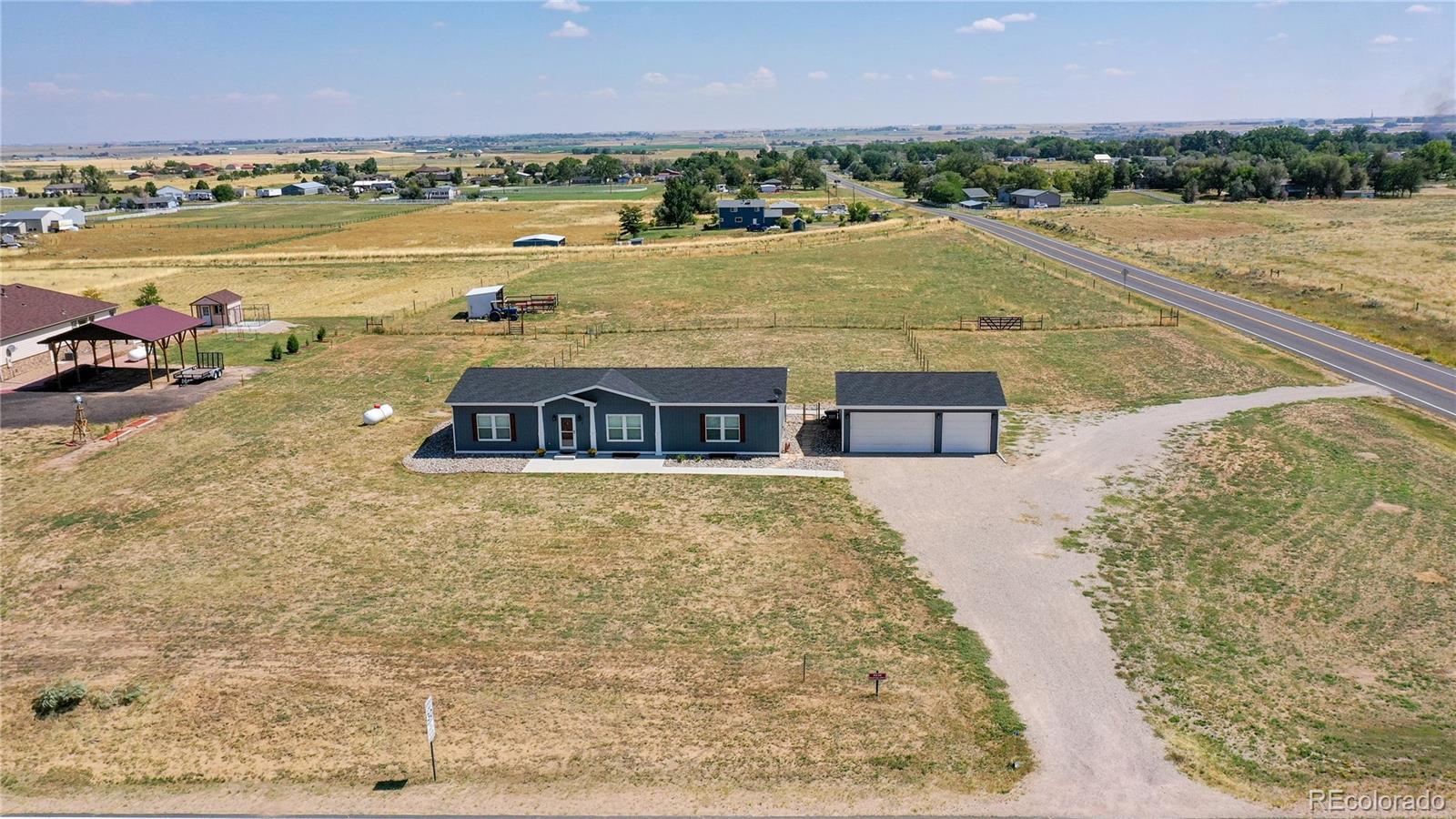 4038 Meadowlark Road Fort Lupton, CO 80621 - Photo 38 of 40 a view of an ocean with city