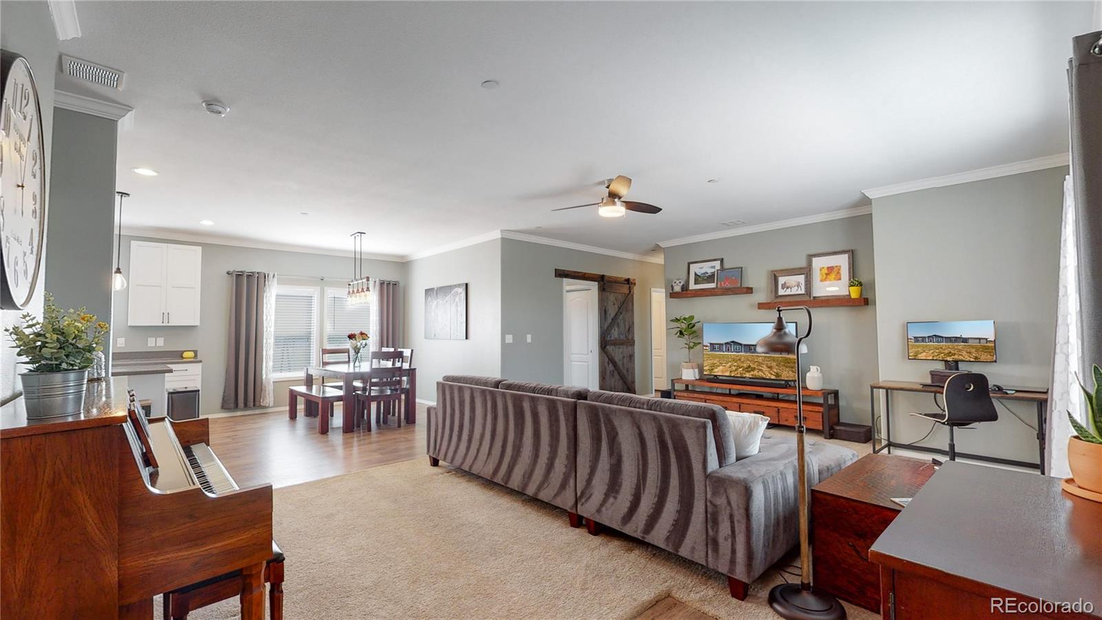 4038 Meadowlark Road Fort Lupton, CO 80621 - Photo 8 of 40 a living room with furniture and a table