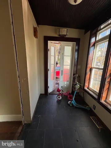 a room with gym equipment and a large window