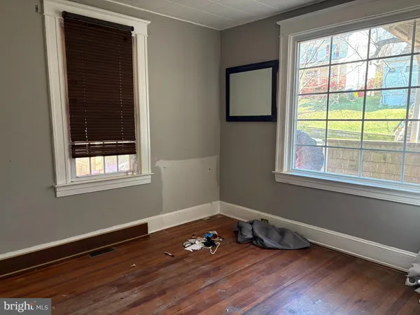 a room with window and wooden floor
