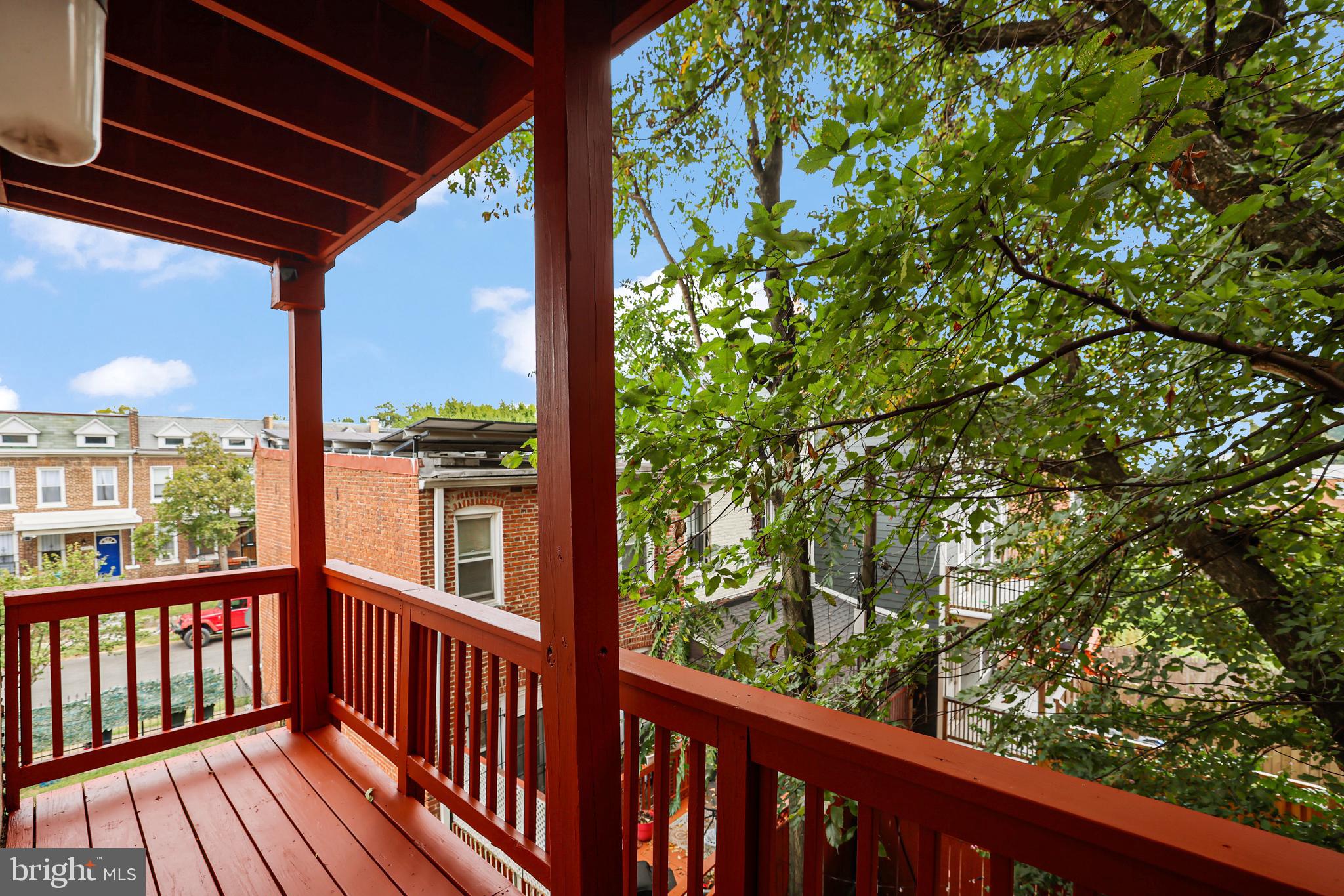 3579 Warder Street Northwest, Unit 3 Washington, DC 20010 - Photo 11 of 25 a view of a balcony with wooden floor