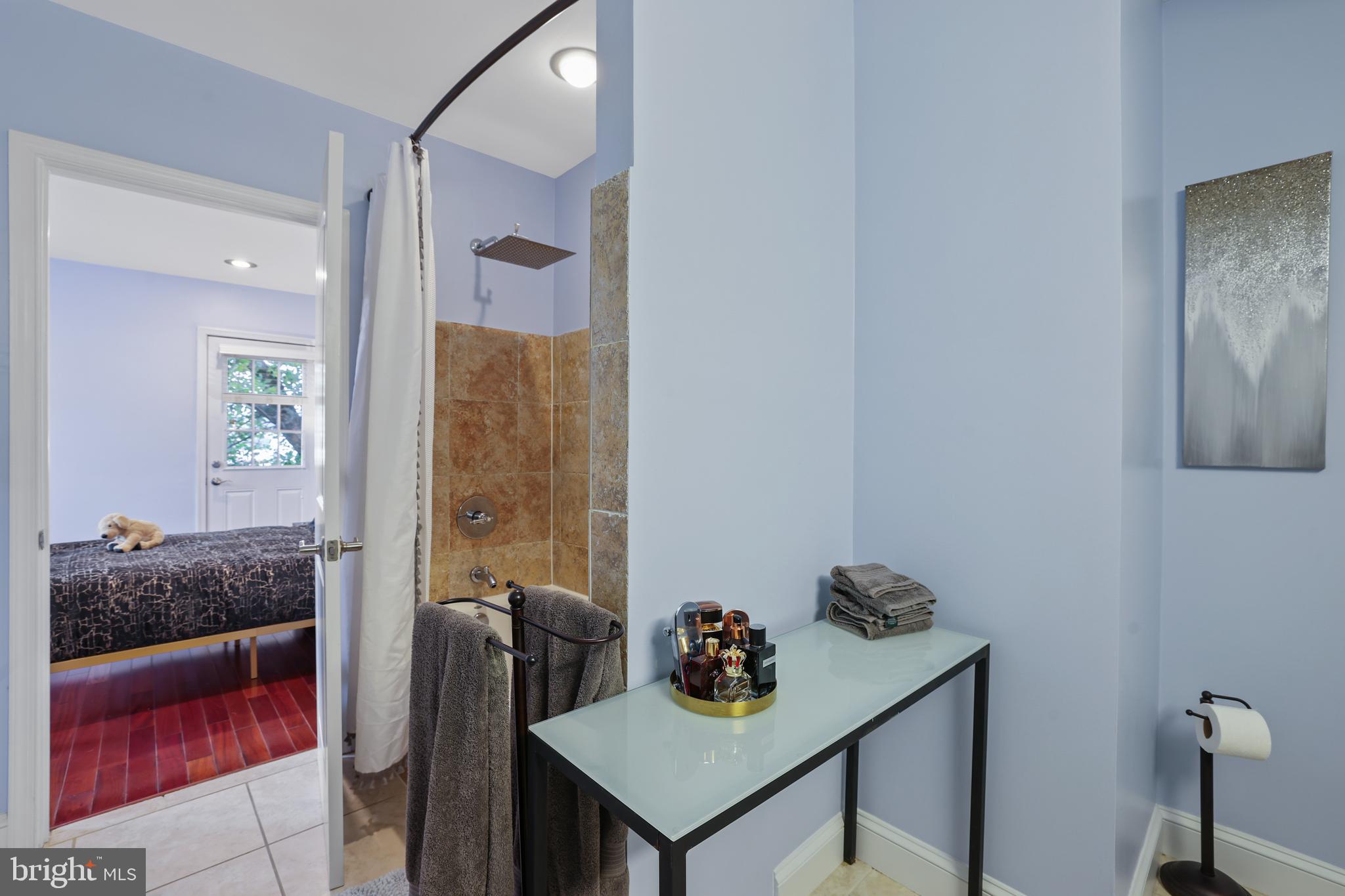 3579 Warder Street Northwest, Unit 3 Washington, DC 20010 - Photo 13 of 25 a view of a bathroom with a tub and shower