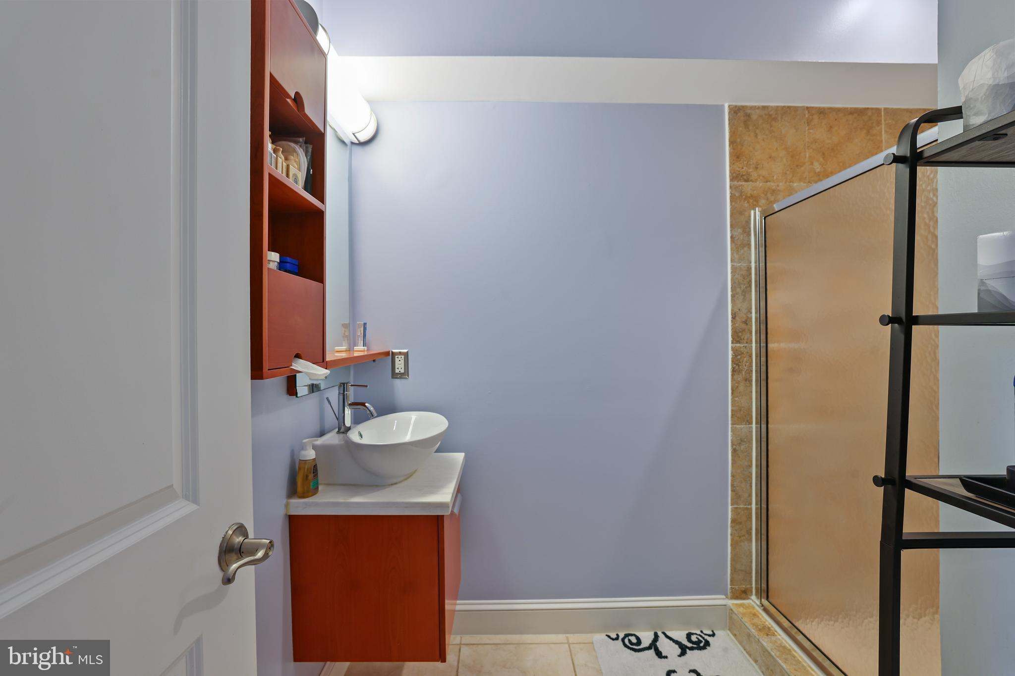 3579 Warder Street Northwest, Unit 3 Washington, DC 20010 - Photo 16 of 25 a bathroom with a sink and a mirror