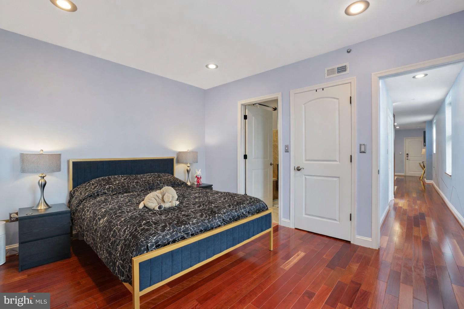 3579 Warder Street Northwest, Unit 3 Washington, DC 20010 - Photo 22 of 25 a bedroom with a bed and wooden floor